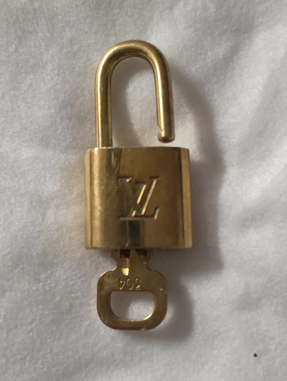 Louis Vuitton Gold-Tone Padlock and Key Set # 304